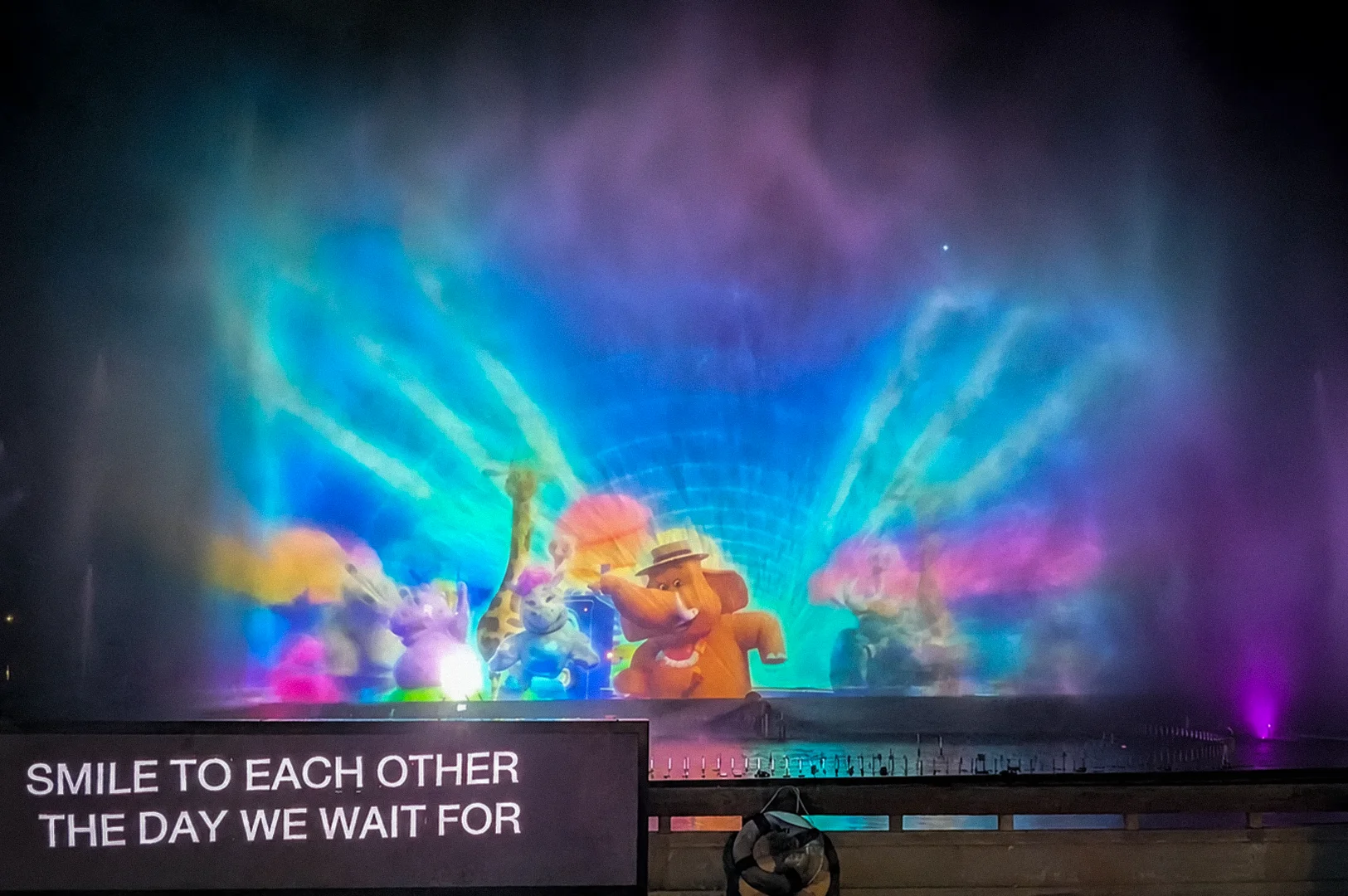 Colorful nighttime water and light projection show with animated animals and glowing mist at Chiang Mai Night Safari fountain attraction