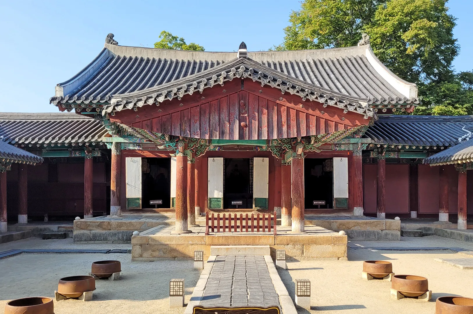 Front view of Gyeonggijeon Shrine in Jeonju, South Korea featuring traditional Joseon-era architecture, ornate wooden details and a historic courtyard.