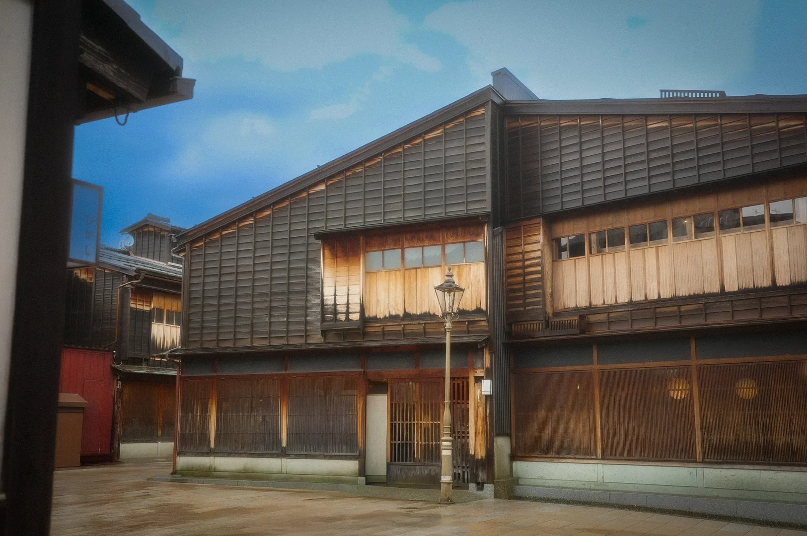 Traditional wooden teahouse buildings in the historic Higashi Chaya District of Kanazawa, Japan, featuring preserved Edo-period architecture, lattice windows, and a quiet stone-paved street.