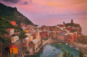 Colorful Cinque Terre coastal village overlooking the Mediterranean Sea at sunset