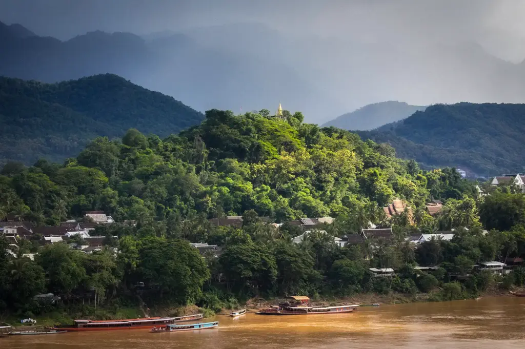 Mount Phou Si in Luang Prabang Laos overlooking the town, Mekong River, and surrounding mountains